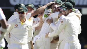 Australia's Pat Cummins, center, celebrates with his team after he got the wicket of Sri Lanka's Lahiru Thirimanne.(AP) Australia's Pat Cummins, center, celebrates with his team after he got the wicket of Sri Lanka's Lahiru Thirimanne.(AP)