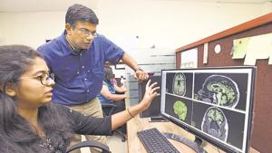 Rajesh Purshottam (standing) with his team member Juhi Desai, R&D manager at his office in NCL innovation park on Tuesday.(Pratham Gokhale/HT Photo) Rajesh Purshottam (standing) with his team member Juhi Desai, R&D manager at his office in NCL innovation park on Tuesday.(Pratham Gokhale/HT Photo)