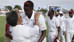 Barbados' Prime Minister Mia Mottley greets West Indies' cricket team captain Jason Holder after day four of the first cricket Test match against England at the Kensington Oval.(AP) Barbados' Prime Minister Mia Mottley greets West Indies' cricket team captain Jason Holder after day four of the first cricket Test match against England at the Kensington Oval.(AP)
