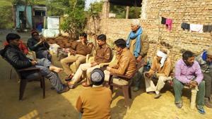 Police advising villagers against the auction programme. Police advising villagers against the auction programme.