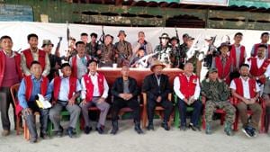 Khango Konyak (in suit and hat) with Isak Sumi (to his left, in a black jacket) and members of the civil society pose with members of the Konyak faction of NSCNK).(HT PHOTO) Khango Konyak (in suit and hat) with Isak Sumi (to his left, in a black jacket) and members of the civil society pose with members of the Konyak faction of NSCNK).(HT PHOTO)