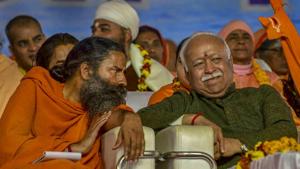 RSS chief Mohan Bhagwat and Baba Ramdev (left) attend Vishwa Hindu Parishad's 'Dharm Sansad' at the Kumbh Mela 2019 in Prayagraj on Thursday.(PTI) RSS chief Mohan Bhagwat and Baba Ramdev (left) attend Vishwa Hindu Parishad's 'Dharm Sansad' at the Kumbh Mela 2019 in Prayagraj on Thursday.(PTI)