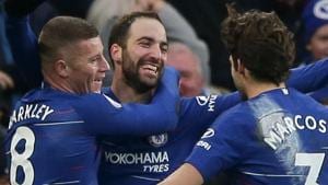 Chelsea's Argentinian striker Gonzalo Higuain (C) celebrates scoring their fourth goal during the English Premier League football match between Chelsea and Huddersfield.(AFP)