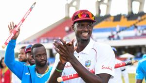 Jason Holder (R) of West Indies celebrates winning on day 3 of the 2nd Test between West Indies and England at Vivian Richards Cricket Stadium in North Sound, Antigua and Barbuda, on February 02, 2019(AFP) Jason Holder (R) of West Indies celebrates winning on day 3 of the 2nd Test between West Indies and England at Vivian Richards Cricket Stadium in North Sound, Antigua and Barbuda, on February 02, 2019(AFP)