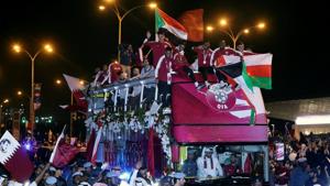 Qatar players celebrate after winning the Asian Cup.(REUTERS)