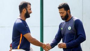 Cheteshwar Pujara shakes hands with Vidarbha’s Wasim Jaffar during a practise session on the eve of Ranji Trophy final in Nagpur.(PTI) Cheteshwar Pujara shakes hands with Vidarbha’s Wasim Jaffar during a practise session on the eve of Ranji Trophy final in Nagpur.(PTI)
