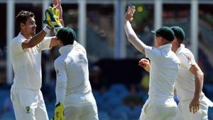 Australia's Mitchell Starc celebrates his wicket off Sri Lanka's batsman Dinesh Chandimal with a teammates during day four of the second Test cricket match between Australia and Sri Lanka at the Manuka Oval Cricket Ground in Canberra on February 4, 2019.(AFP) Australia's Mitchell Starc celebrates his wicket off Sri Lanka's batsman Dinesh Chandimal with a teammates during day four of the second Test cricket match between Australia and Sri Lanka at the Manuka Oval Cricket Ground in Canberra on February 4, 2019.(AFP)