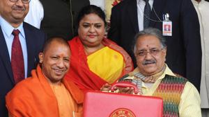 Uttar Pradesh Chief Minister Yogi Adityanath along with state's Finance Minister Rajesh Agarwal displaying budget briefcase ahead of state budget in Vidhan Sabha in Lucknow on Thursday.(ANI) Uttar Pradesh Chief Minister Yogi Adityanath along with state's Finance Minister Rajesh Agarwal displaying budget briefcase ahead of state budget in Vidhan Sabha in Lucknow on Thursday.(ANI)