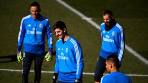 Real Madrid's Belgian goalkeeper Thibaut Courtois (C) stands with teammates during a training session at the club's training ground in the outskirts of Madrid(AFP) Real Madrid's Belgian goalkeeper Thibaut Courtois (C) stands with teammates during a training session at the club's training ground in the outskirts of Madrid(AFP)