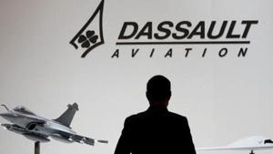 A visitor looks at replicas of the fighter jet Rafale (L).(REUTERS FILE PHOTO) A visitor looks at replicas of the fighter jet Rafale (L).(REUTERS FILE PHOTO)