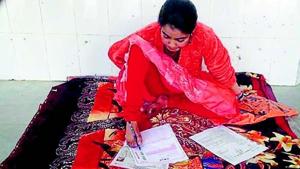 Ankita writes her intermediate exam papers using toes at Chapra Zila High School in Saran district.(HT photo) Ankita writes her intermediate exam papers using toes at Chapra Zila High School in Saran district.(HT photo)
