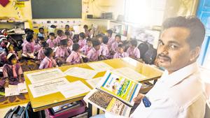 Rajan Garud, a teacher at Khorichapada zilla parishad school in Palghar, translated textbooks into Warli, a language spoken in Palghar, south Gujarat and parts of Nashik, to help students transition to Marathi with ease.(PRAMOD THAKUR/HT PHOTO) Rajan Garud, a teacher at Khorichapada zilla parishad school in Palghar, translated textbooks into Warli, a language spoken in Palghar, south Gujarat and parts of Nashik, to help students transition to Marathi with ease.(PRAMOD THAKUR/HT PHOTO)