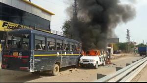 A clash broke out between police and protesters at Dholpur Highway today where the latter had blocked the road and set vehicles ablaze on February 10.(ANI Photo) A clash broke out between police and protesters at Dholpur Highway today where the latter had blocked the road and set vehicles ablaze on February 10.(ANI Photo)