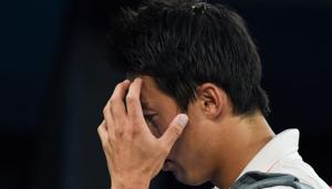 Japan's Kei Nishikori leaves the court after he retired injured during his men's singles quarter-final match against Serbia's Novak Djokovic(AFP) Japan's Kei Nishikori leaves the court after he retired injured during his men's singles quarter-final match against Serbia's Novak Djokovic(AFP)