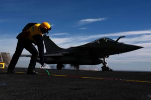 A French Rafale fighter jet takes off from the A French Rafale fighter jet takes off from the