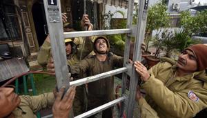 Firemen engaged in rescue operation at Hotel Arpit Palace that caught fire early Tuesday killing 17 people.(Biplov Bhuyan/HT [hoto) Firemen engaged in rescue operation at Hotel Arpit Palace that caught fire early Tuesday killing 17 people.(Biplov Bhuyan/HT [hoto)