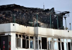View of the hotel after a massive fire broke out at Karol Baghs Arpit Palace hotel in which at least 17 people were killed and several injured, in New Delhi on Tuesday.(ANI photo) View of the hotel after a massive fire broke out at Karol Baghs Arpit Palace hotel in which at least 17 people were killed and several injured, in New Delhi on Tuesday.(ANI photo)