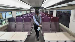 A worker cleans the interior of T-18 train on January 2.(Burhaan Kinu/HT PHOTO) A worker cleans the interior of T-18 train on January 2.(Burhaan Kinu/HT PHOTO)