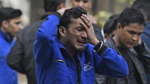 A man breaks down after getting the news of his brother's death at the fire in Karol Bagh’s Arpit Palace hotel, in New Delhi, India, on Tuesday, February 12, 2019.(Sanchit Khanna/HT Photo) A man breaks down after getting the news of his brother's death at the fire in Karol Bagh’s Arpit Palace hotel, in New Delhi, India, on Tuesday, February 12, 2019.(Sanchit Khanna/HT Photo)