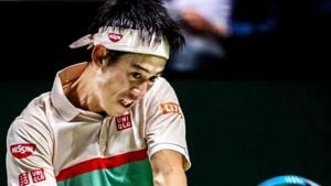 Japan's Kei Nishikori plays a backhand return to France's Pierre-Hugues Herbert during their men's singles match on day two of the ABN AMRO World Tennis Tournament in Rotterdam.(AFP)