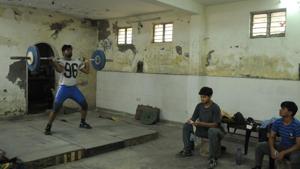 Weightlifters during a practice session at the basement of the Nehru Stadium, Gurugram.(Parveen Kumar / HT Photo) Weightlifters during a practice session at the basement of the Nehru Stadium, Gurugram.(Parveen Kumar / HT Photo)