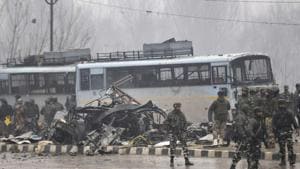 Security forces near the damaged vehicles at Lethpora on the Jammu-Srinagar highway, February 14(Waseem Andrabi/HT) Security forces near the damaged vehicles at Lethpora on the Jammu-Srinagar highway, February 14(Waseem Andrabi/HT)