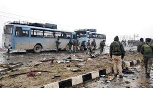 Security personnel examine the debris after an explosion in Lethpora in South Kashmir's Pulwama on February 14, 2019.(Reuters) Security personnel examine the debris after an explosion in Lethpora in South Kashmir's Pulwama on February 14, 2019.(Reuters)