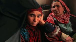 Fahmeeda (Left), mother of Adil Ahmad Dar, who claimed responsibility for the Pulwama terror attack, sits inside her home in Gundbagh village in south Kashmir's Pulwama district.(Reuters) Fahmeeda (Left), mother of Adil Ahmad Dar, who claimed responsibility for the Pulwama terror attack, sits inside her home in Gundbagh village in south Kashmir's Pulwama district.(Reuters)