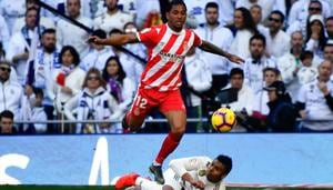 Girona's Brazilian midfielder Douglas Luiz jumps over Real Madrid's Brazilian midfielder Casemiro (bottom) during the Spanish League football match between Real Madrid and Girona at the Santiago Bernabeu stadium in Madrid on February 17, 2019(AFP) Girona's Brazilian midfielder Douglas Luiz jumps over Real Madrid's Brazilian midfielder Casemiro (bottom) during the Spanish League football match between Real Madrid and Girona at the Santiago Bernabeu stadium in Madrid on February 17, 2019(AFP)