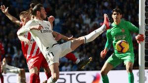 Real Madrid's Gareth Bale in action with Girona's Raul Garcia Carnero.(REUTERS) Real Madrid's Gareth Bale in action with Girona's Raul Garcia Carnero.(REUTERS)