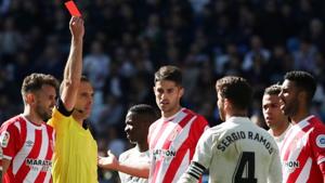 Real Madrid's Sergio Ramos is shown a red card by referee Guillermo Cuadra.(Reuters) Real Madrid's Sergio Ramos is shown a red card by referee Guillermo Cuadra.(Reuters)