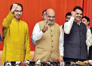 BJP President Amit Shah with Shiv Sena chief Uddhav Thackeray and Maharashtra Cm Devendra Fadnavis on Monday.(PTI)