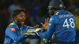 File image of Sri Lanka's Akila Dananjaya celebrating a wicket with his teammate Niroshan Dickwella.(AFP) File image of Sri Lanka's Akila Dananjaya celebrating a wicket with his teammate Niroshan Dickwella.(AFP)