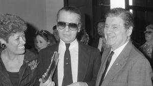 FILE - In this Oct. 5, 1985 file photo, from left, Carla Fendi, Karl Lagerfeld and U.S. Ambassador to Rome, Maxwell Rabb, attend the opening of an exhibition at Rome's National Gallery of Modern Art to celebrate the 20-year-collaboration between Lagerfeld and Fendi. Chanel's iconic couturier, Karl Lagerfeld, whose accomplished designs as well as trademark white ponytail, high starched collars and dark enigmatic glasses dominated high fashion for the last 50 years, has died. He was around 85 years old. (AP Photo/Massimo Sambucetti, File )(AP) FILE - In this Oct. 5, 1985 file photo, from left, Carla Fendi, Karl Lagerfeld and U.S. Ambassador to Rome, Maxwell Rabb, attend the opening of an exhibition at Rome's National Gallery of Modern Art to celebrate the 20-year-collaboration between Lagerfeld and Fendi. Chanel's iconic couturier, Karl Lagerfeld, whose accomplished designs as well as trademark white ponytail, high starched collars and dark enigmatic glasses dominated high fashion for the last 50 years, has died. He was around 85 years old. (AP Photo/Massimo Sambucetti, File )(AP)