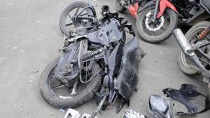 Mangled remains of the motorcycle, which was hit by an unknown vehicle. The impact of the hit was such that the two riders were thrown off the bike and crashed into an electricity pole, sustaining severe head injuries.(Sunil Ghosh / HT Photo) Mangled remains of the motorcycle, which was hit by an unknown vehicle. The impact of the hit was such that the two riders were thrown off the bike and crashed into an electricity pole, sustaining severe head injuries.(Sunil Ghosh / HT Photo)