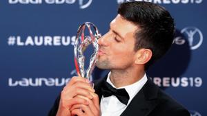 Laureus World Sportsman of The Year 2019 winner Serbia's tennis player Novak Djokovic poses with his award.(AFP)