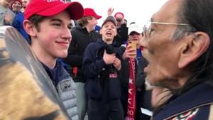 Nicholas Sandmann, 16, a student from Covington Catholic High School stands in front of Native American activist Nathan Phillips in Washington.(REUTERS)