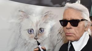 Karl Lagerfeld poses next to a painting of his cat Choupette during the inauguration of the show Corsa Karl and Choupette at the Palazzo Italia in Berlin.(AFP) Karl Lagerfeld poses next to a painting of his cat Choupette during the inauguration of the show Corsa Karl and Choupette at the Palazzo Italia in Berlin.(AFP)