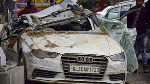 Passers-by look at the mangled remains of an Audi car which collided with a dumper at Rohini, in New Delhi, Wednesday, Feb. 20, 2019, killing three of the four occupants of the car.(PTI) Passers-by look at the mangled remains of an Audi car which collided with a dumper at Rohini, in New Delhi, Wednesday, Feb. 20, 2019, killing three of the four occupants of the car.(PTI)