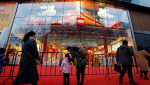 A woman talks to a girl outside the newly opened flagship store of Danish toymaker Lego near Wangfujing shopping street in Beijing on February 22.(REUTERS) A woman talks to a girl outside the newly opened flagship store of Danish toymaker Lego near Wangfujing shopping street in Beijing on February 22.(REUTERS)