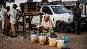 A woman selling food waits for costumers. Image for representation.(AFP file photo) A woman selling food waits for costumers. Image for representation.(AFP file photo)