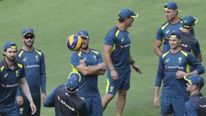Aaron Finch looks on as his team members warm up with a ball during a practice session.(AP) Aaron Finch looks on as his team members warm up with a ball during a practice session.(AP)