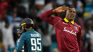 Sheldon Cottrell celebrates the dismissal of Adil Rashid.(AFP) Sheldon Cottrell celebrates the dismissal of Adil Rashid.(AFP)