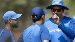 Mahendra Singh Dhoni, center, and Rishabh Pant, left, listen to team coach Ravi Shastri.(AP) Mahendra Singh Dhoni, center, and Rishabh Pant, left, listen to team coach Ravi Shastri.(AP)