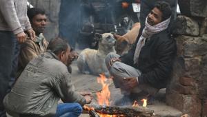 People seen sitting near bonfire to keep themselves warm on a cold winter morning at I.P.Extension, in New Delhi(Sushil Kumar/HT PHOTO) People seen sitting near bonfire to keep themselves warm on a cold winter morning at I.P.Extension, in New Delhi(Sushil Kumar/HT PHOTO)