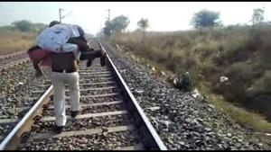 Policeman carrying injured persona on his shoulder in Hoshangabad district on Saturday Policeman carrying injured persona on his shoulder in Hoshangabad district on Saturday