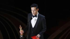 Rami Malek reacts while holding his Oscar after accepting the Best Actor award for his role in Rami Malek reacts while holding his Oscar after accepting the Best Actor award for his role in