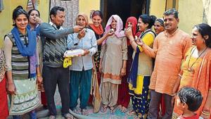 Sneha and Suman’s family members celebrate in their village Kathikhera in Hapur district of Uttar Pradesh on Monday.(HT PHOTO) Sneha and Suman’s family members celebrate in their village Kathikhera in Hapur district of Uttar Pradesh on Monday.(HT PHOTO)