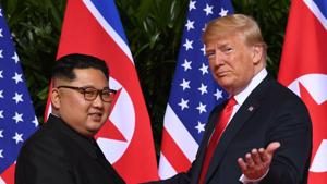 US President Donald Trump meets with North Korea's leader Kim Jong Un at the start of their historic US-North Korea summit, at the Capella Hotel on Sentosa island in Singapore, on June 12, 2018.(AFP)