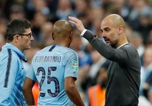 Soccer Football - Carabao Cup Final - Manchester City v Chelsea - Wembley Stadium, London, Britain - February 24, 2019 Manchester City manager Pep Guardiola with Fernandinho(REUTERS) Soccer Football - Carabao Cup Final - Manchester City v Chelsea - Wembley Stadium, London, Britain - February 24, 2019 Manchester City manager Pep Guardiola with Fernandinho(REUTERS)